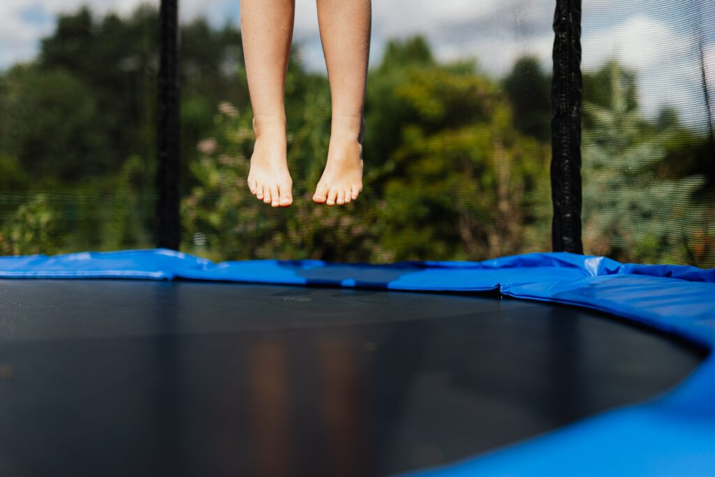 child bouncing on a trampoline